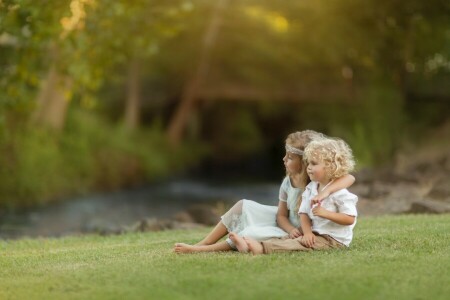 a couple, boy, children, curls, girl, hugs, Kevin Cook, lawn