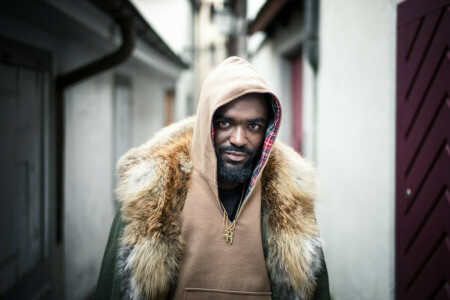 beard, direct gaze, hood, Man, necklace, people, street, to be continued...