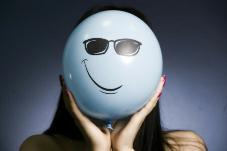 A balloon, girl, glasses, smile