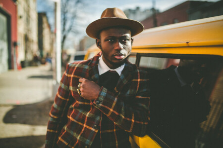 cars, city, eyes, hat, jacket, lamppost, lips, male