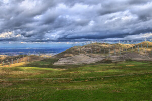 clouds, generator, grass, mill, mountains, sea, the sky