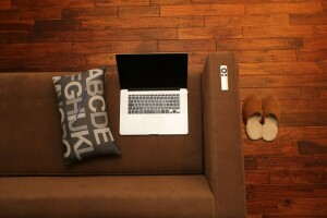 laptop, pencil, pillow, slippers, sofa