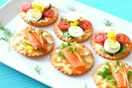 appetizer, canapés, crackers, egg, greens, salmon, sauce, tomatoes