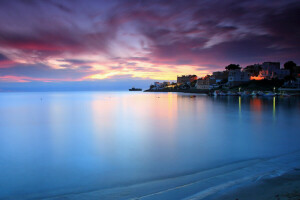 sea, the city, the evening