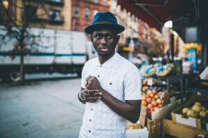 bokeh, city, eyes, fruit, hands, hat, lips, male