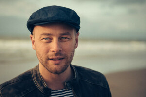 beard, direct look, hat, jacket, male