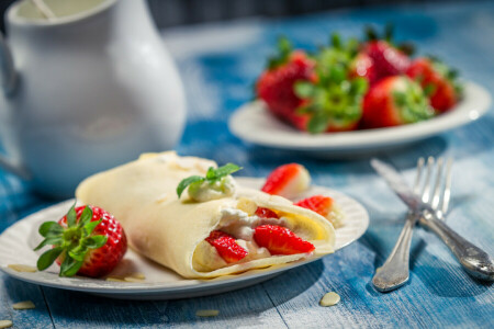 En läcker dessert, bär, pannkakor, jordgubbar, jordgubb