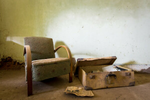 chair, newspaper, suitcase