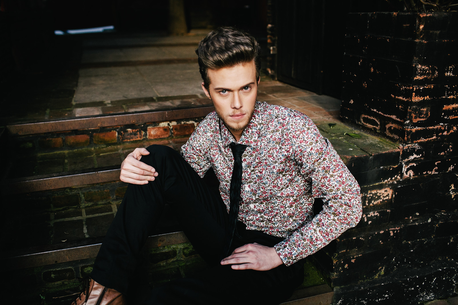 Man, building, abandoned, beard, pants, dress shirt, direct gaze