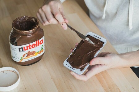 hands, knife, Nutella, phone, table