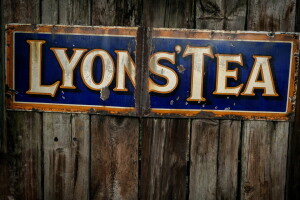 Lyons' Tea, street sign, text